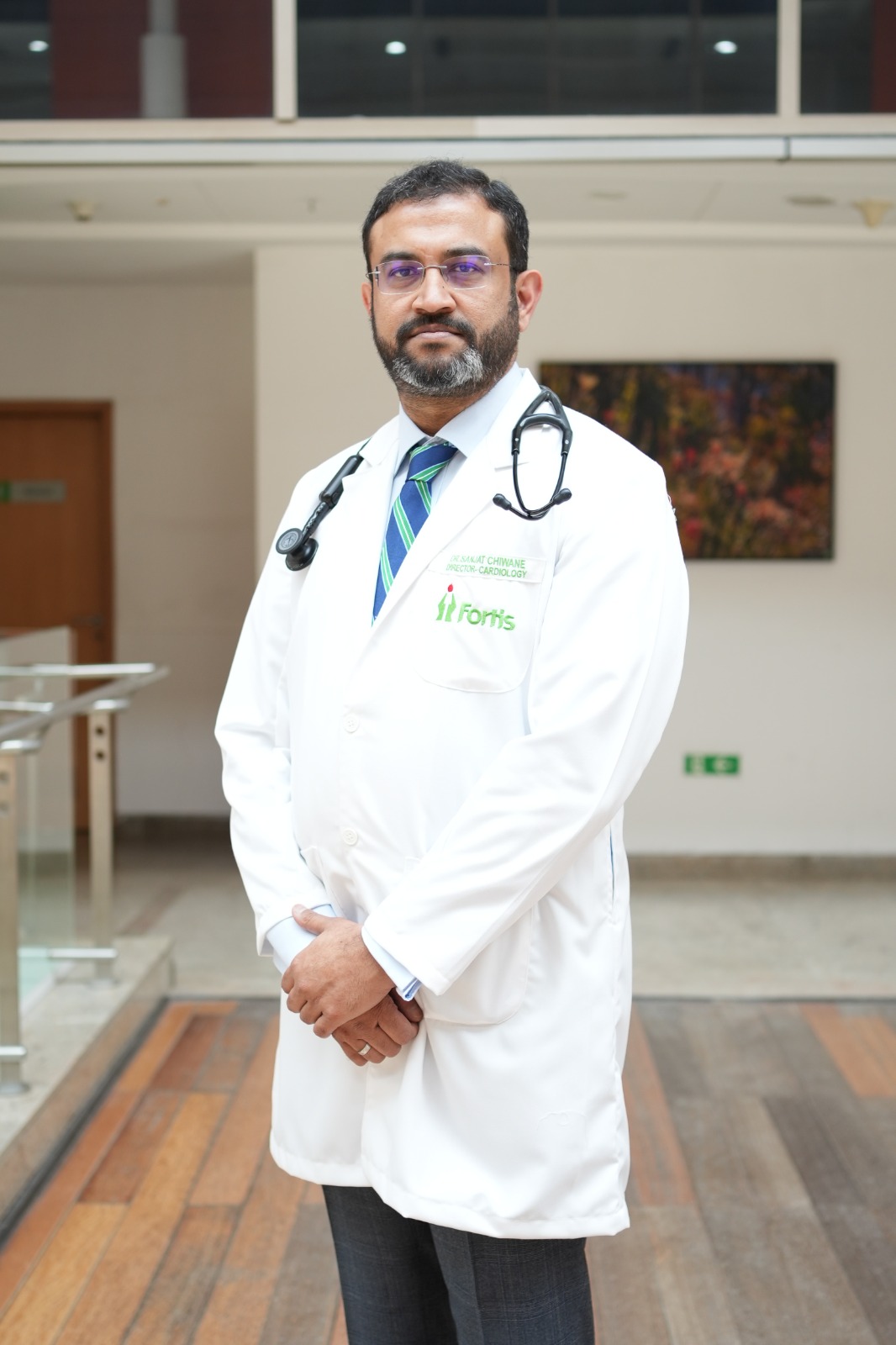 Dr. Sanjat Chiwane standing in a white coat